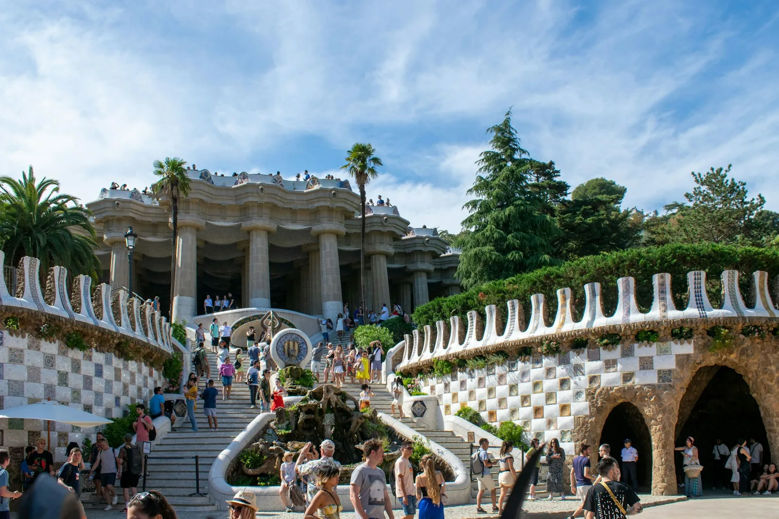 The Dragon Staircase at Park Güell in Barcelona with the colourful El Drac mosaic salamander